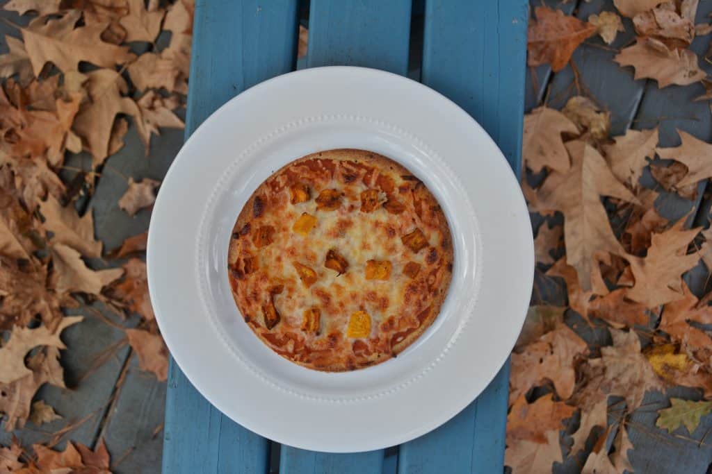 Pumpkin pizza recipe. This savory fall recipe is family-friendly and takes pumpkin to a new level. #fallrecipe #kidfriendlyrecipe #vegetarianrecipe #reesewoodsfitness www.reesewoods.com