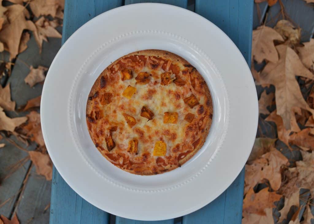 Pumpkin pizza recipe. This savory fall recipe is family-friendly and takes pumpkin to a new level. #fallrecipe #kidfriendlyrecipe #vegetarianrecipe #reesewoodsfitness www.reesewoods.com