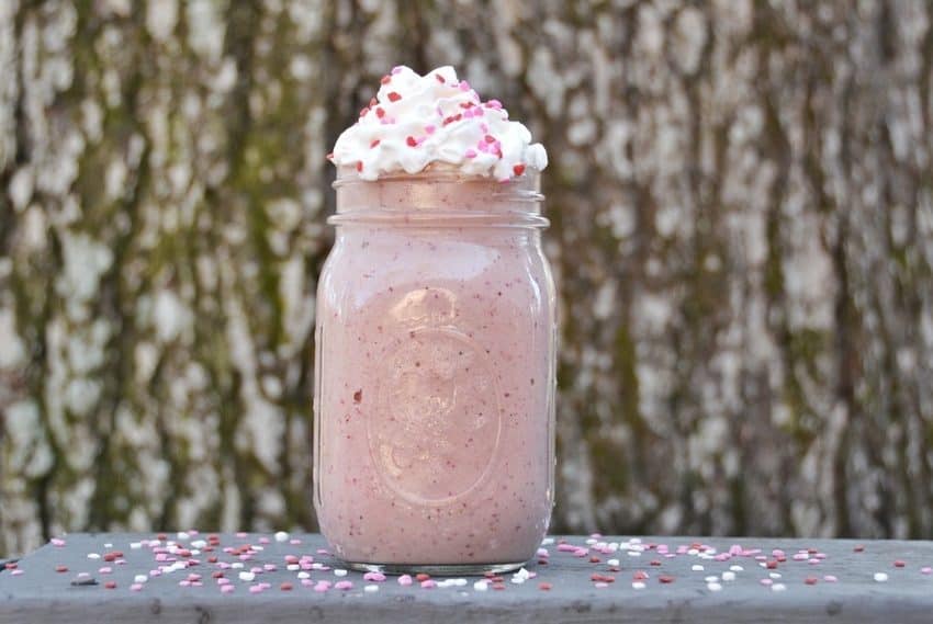 Chocolate covered strawberries smoothie recipe. This healthy Valentine's Day recipe will help satisfy your sweet tooth while keeping your weight loss goals on track. This protein smoothie serves as a full meal replacement shake and it delicious and nutritious. This smoothie recipe is vegan and vegetarian friendly. Gluten-free, keto, and kid-friendly recipe for the whole family. #valentinesdayrecipes #smoothierecipes #weightlossrecipes #reesewoodsfitness reesewoods.com
